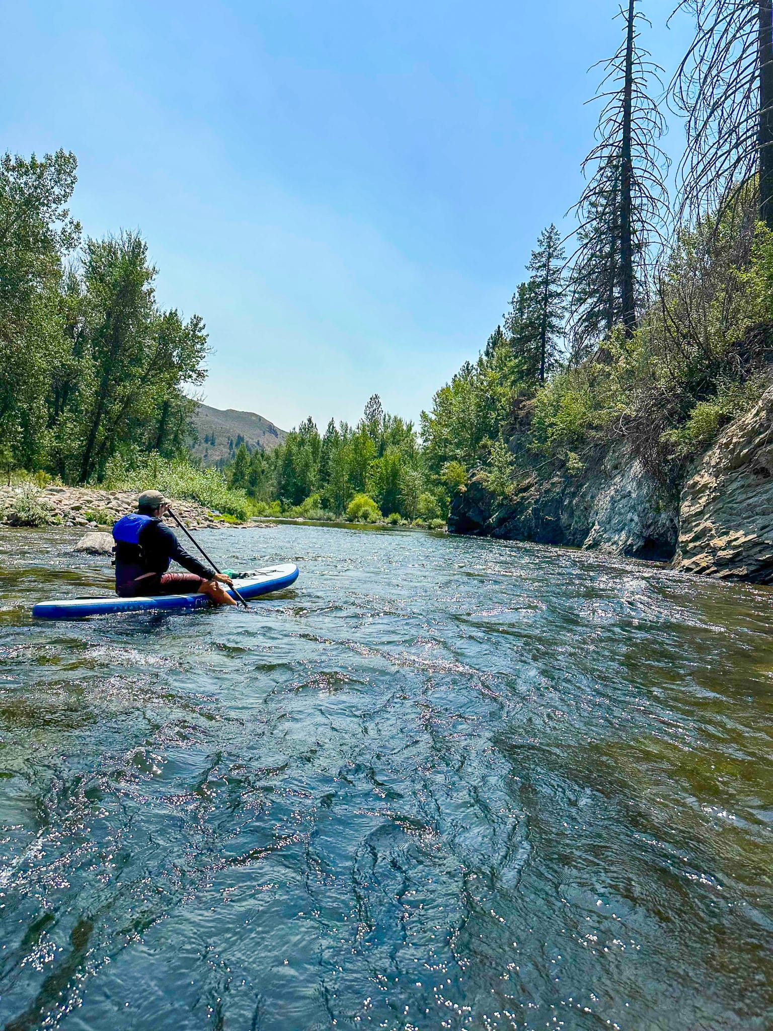 paddleboarding on river